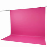 Pink seamless paper backdrop on studio background with support rod