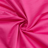 Bright pink fabric swirl texture close-up with soft folds