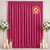Pink flame retardant curtain with floral stands and candles for event backdrop