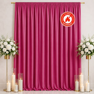 Pink flame retardant curtain with floral stands and candles for event backdrop