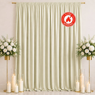 Elegant cream curtain backdrop with floral stands, candles, and flame-retardant label