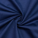 Navy blue ribbed knit fabric close-up with soft folds