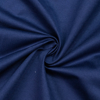 Navy blue ribbed knit fabric close-up with soft folds