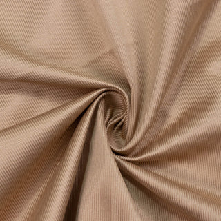 Beige ribbed fabric texture with soft spiral folds