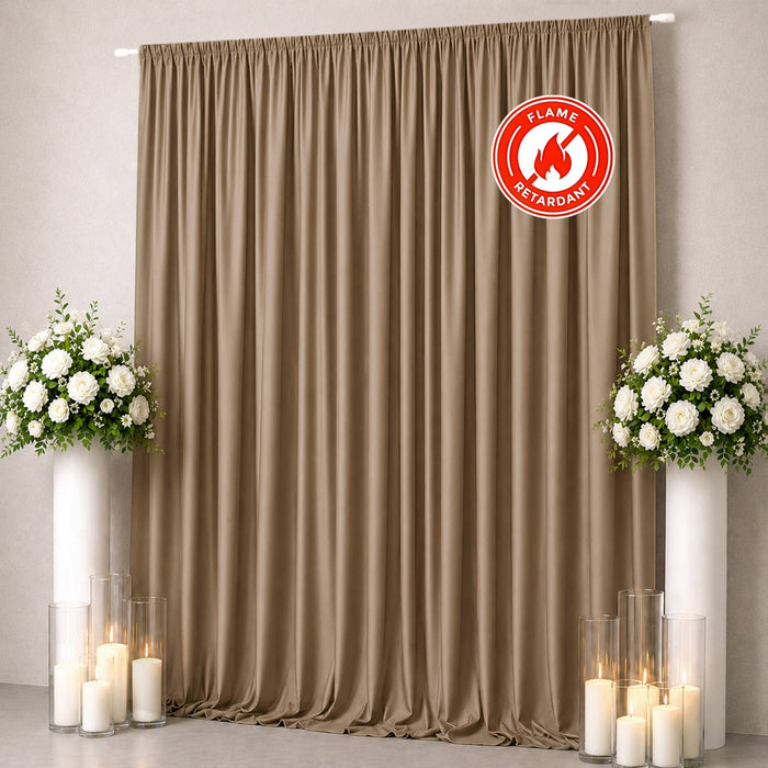 Flame-retardant beige wedding curtain backdrop with floral arrangements and candles