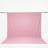 Pink seamless photography backdrop on a backdrop stand#whtbkgd