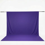 Purple fabric backdrop on a hanging rod with floor extension#whtbkgd