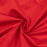 Red ribbed fabric texture with swirl fold pattern