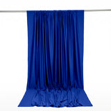 Blue satin draped backdrop curtain hanging on a rod