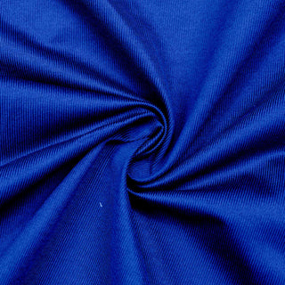 Close-up of bright blue ribbed fabric with gathered folds