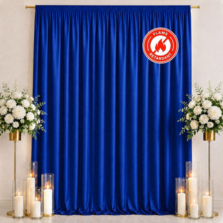 Blue flame retardant curtain with floral decor and candles on stage backdrop