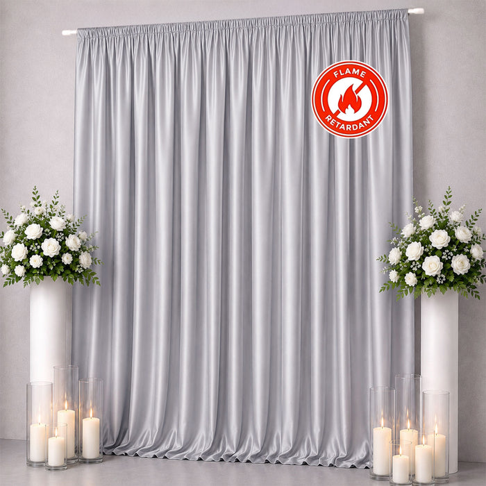 Gray flame-retardant curtain backdrop with floral arrangements and candles