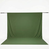 Green fabric backdrop hanging on a crossbar with seamless floor extension#whtbkgd
