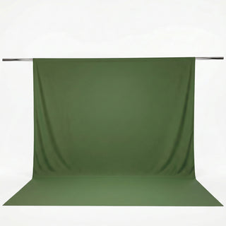 Green fabric backdrop hanging on a crossbar with seamless floor extension#whtbkgd