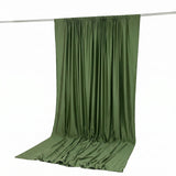 Olive green draped fabric curtain backdrop on studio rod