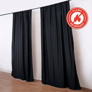 Black flame retardant curtains on a curtain rod in a modern room