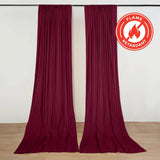 Maroon flame retardant curtains hanging on a track in a room