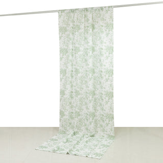 Floral patterned curtain in green and white hanging from a rod