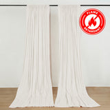 White flame retardant curtains hanging on a rod in a bright room