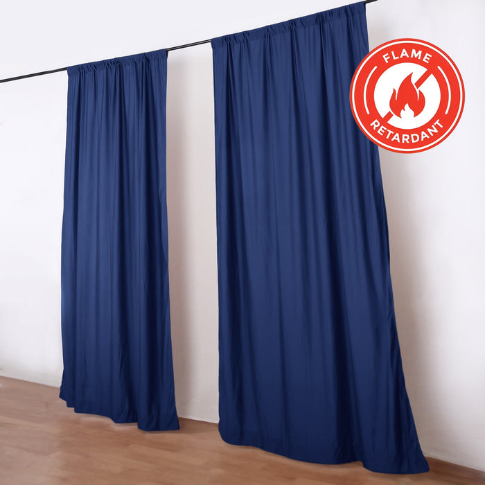 Blue flame-retardant curtain panels on rod with fire safety badge