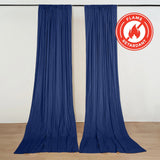 Blue flame retardant curtains hanging on a wall with fire safety label