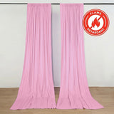 Pink flame-retardant draped curtains on wall-mounted rod display