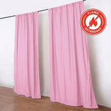 Pink flame-retardant curtains on black rod in a white room
