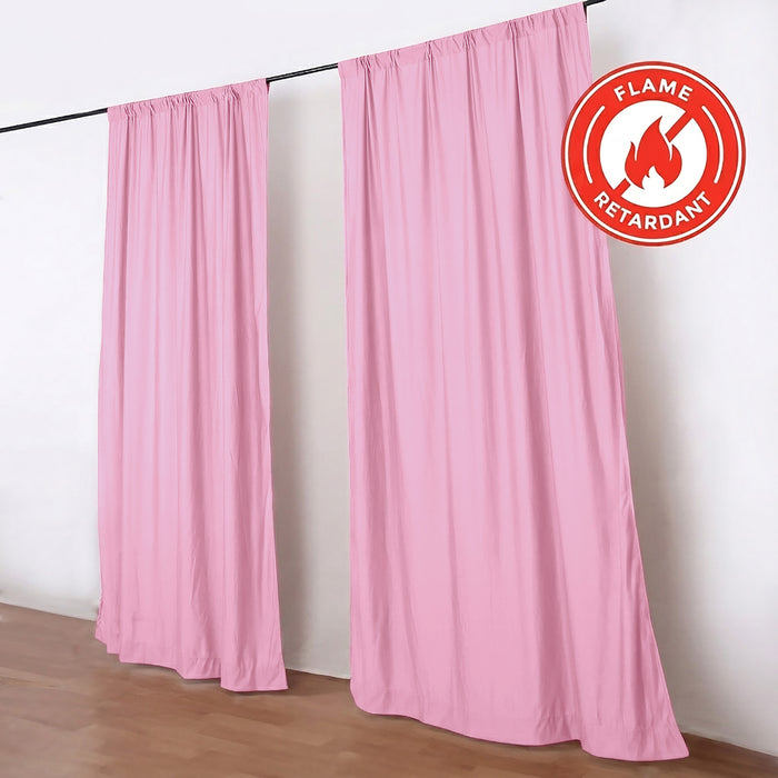 Pink flame-retardant curtains on black rod in a white room