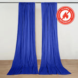 Blue flame-retardant stage curtains on a rod in a studio setting