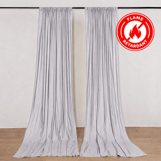 Flame retardant silver curtains on wall-mounted rod in neutral room