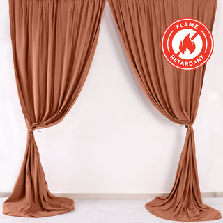 Flame retardant brown curtains elegantly draped in a studio setting.