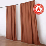 Flame retardant brown curtains hanging on a black rod in a minimalist room