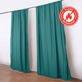 Teal flame retardant curtains on a black rod in a room