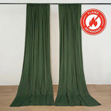 Green flame retardant curtains hanging on a wall in a showroom.