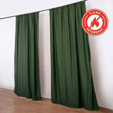 Green flame retardant curtains hanging on a black rod in a room