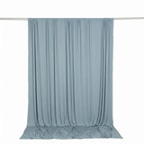 Light blue sheer curtain backdrop on hanging rod