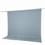 Light blue fabric backdrop on a hanging rod with floor sweep
