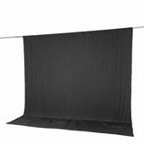 Black photo backdrop curtain on stand with floor sweep, studio background