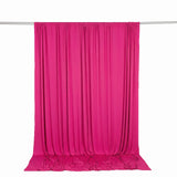 Bright pink sheer curtain draped on a rod against a white background