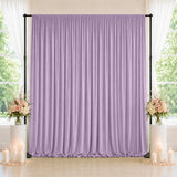 Lavender wedding backdrop with floral arrangements and candles