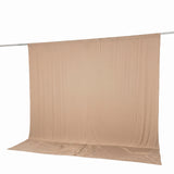 Beige seamless photo backdrop on hanging support stand
