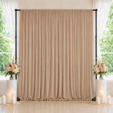 Elegant beige wedding backdrop with flowers and candles by bright windows