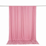 Pink sheer fabric curtain hanging on a rod, draped backdrop for photography