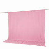 Pink fabric backdrop hung on a rod, isolated on white background