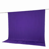 Purple fabric backdrop with hanging crossbar and floor sweep on white background