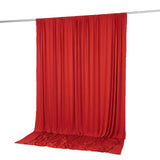 Red draped fabric backdrop hanging on a pole, isolated on white background