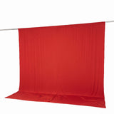 Red fabric backdrop hanging on a clothesline against a white background