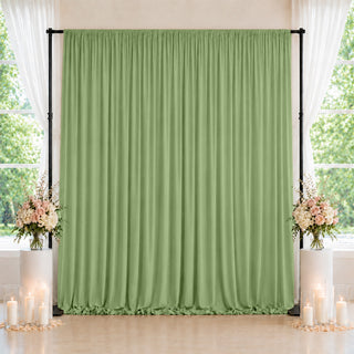 Green wedding backdrop curtain with floral arrangements and candles, indoor event decor