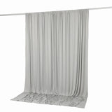 Light gray draped curtain panel on a rod, studio background