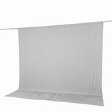 White fabric backdrop on crossbar stand with floor sweep